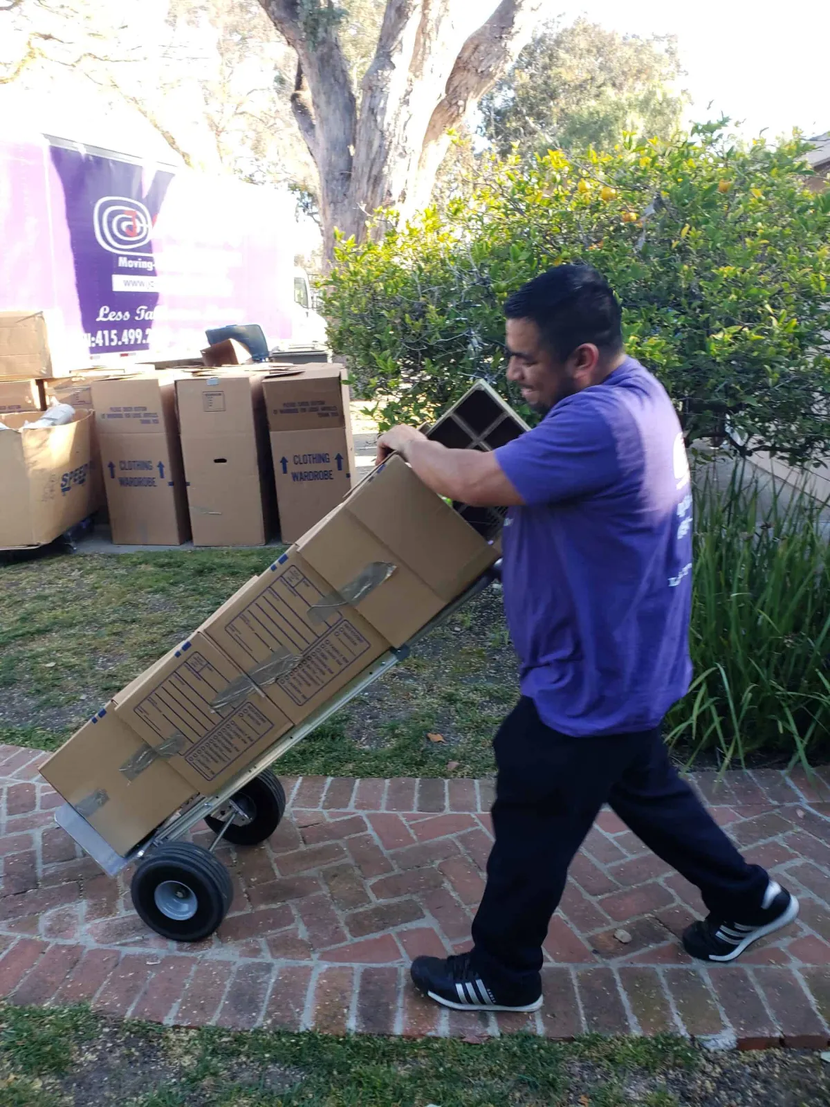 Movers carrying items to truck