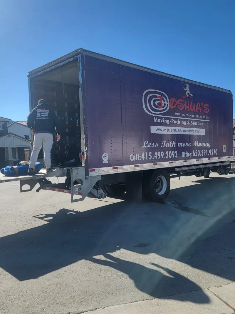 Professional movers handling a heavy safe